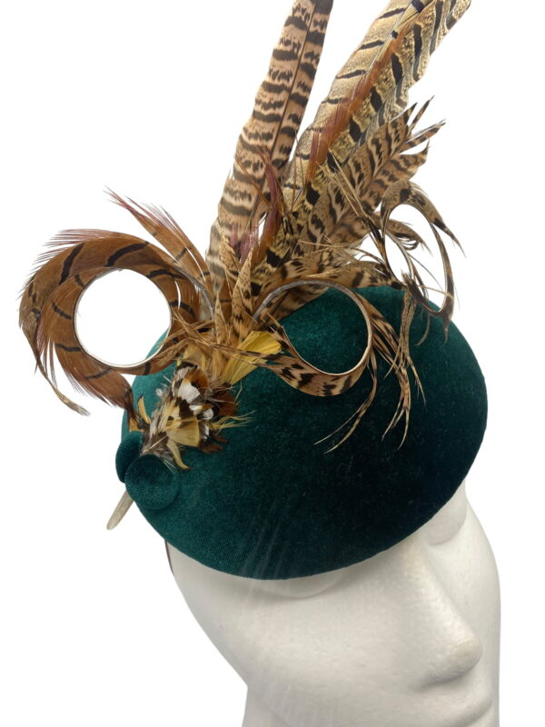 Green velvet feathered headpiece.